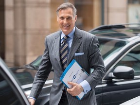 Conservative MP Maxime Bernier arrives outside the offices of the Conservative Party of Canada as he officially launches his bid for the leadership of the party, on Thursday, April 7, 2016 in Ottawa. THE CANADIAN PRESS/Justin Tang