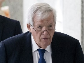 Former U.S. House of Representatives Speaker Dennis Hastert exits after an appearance in federal court in Chicago, in this file photo taken June 9, 2015. Hastert, convicted last year of a financial crime in a hush-money case, had agreed to pay $3.5 million to buy the silence of an individual who he sexually abused when the victim was a teenager, federal prosecutors said on Friday.  REUTERS/Andrew Nelles/Files