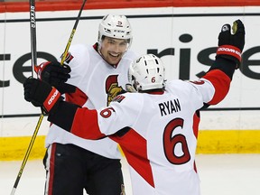 Ottawa Senators' Cody Ceci and Bobby Ryan celebrate a third-period goal against the Minnesota Wild in St. Paul, Minn., on March 31, 2016. (AP Photo/Jim Mone)