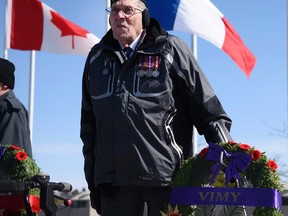 Second World War veteran John R. Newell, who was 13 when he was part of a pilgrimage that saw the opening of the Vimy Memorial, stands following a ceremony to commemorate the 99th anniversary of the start of the Battle of Vimy Ridge in Ottawa Saturday.