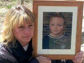 Sandra Gibbons, of Straffordville, Ont., holds a picture of her late son Ryan, at age 9, who died in October 2012, at age 12, after suffering an asthma attack at school during recess, but didn't have his inhaler with him due to a school board policy. This led to the creation of Ryan's Law that requires all Ontario school boards to allow students to keep an inhaler with them. Handout/Chatham Daily News