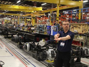 Norm Proulx, manager of manufacturing, shows the start of the assembly line at Woodstock's Hino Motors plant on Friday, April 8, 2016. Hino hosted plant tours as part of the 10th anniversary celebration. (MEGAN STACEY/Sentinel-Review)