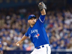 Toronto Blue Jays starting pitcher Marco Estrada throws against the Boston Red Sox during the first inning of their American League MLB baseball game in Toronto, Sunday, April 10, 2016. (THE CANADIAN PRESS/Fred Thornhill)