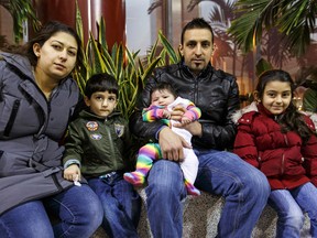 Mahmoud El Annan (second from right) poses for a photo with his family, including wife Maysaa (left), Abbas (second from left), 3, Kadinje, 4, and baby daughter Ezabella, in Edmonton, Alta., on Wednesday January 6, 2016. Mahmoud El Annan faces deportation from Canada by the end of the month, and is receiving help from his brother Wissam, who is from Fort McMurray. Ian Kucerak