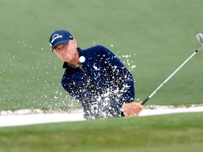 Davis Love III hits out of a bunker on the 2nd hole during the final round of the 2016 The Masters golf tournament at Augusta National Golf Club. Mandatory Credit: Michael Madrid-USA TODAY Sports
