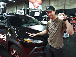 Jeff Savoie won the grand prize draw of a 2016 Jeep Cherokee the Edmonton Sun gave away at the 2016 Edmonton Motor Show in Edmonton, April 10, 2016.