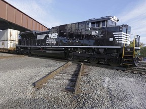 A Norfolk Southern locomotive is shown on Chicago's south side in this Oct. 23, 2014 file photo. Canadian Pacific Railway Ltd has given up on its attempt to merge with Norfolk Southern Corp, a move that had been resisted by the Virginia-based railway company.THE CANADIAN PRESS/AP Photo - M. Spencer Green
