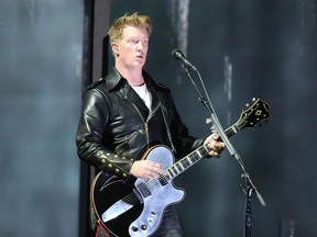 In this Jan. 26, 2014 file photo, Joshua Homme, of Queens of the Stone Age, performs at the 56th annual Grammy Awards in Los Angeles.  (Photo by Matt Sayles/Invision/AP, File)