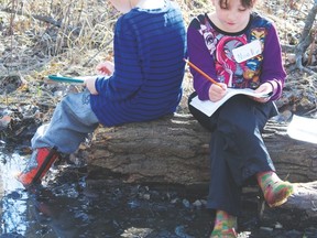 These two participants of the Nature Play program paired up for a couple of activities such as a scavenger hunt that began on April 2.