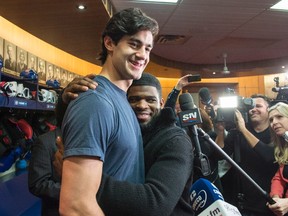 Montreal Canadiens defenceman P.K. Subban hugs captain Max Pacioretty at the team training facility in Brossard, Que., on April 11, 2016. (THE CANADIAN PRESS/Paul Chiasson)