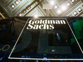 A Goldman Sachs sign is seen above the floor of the New York Stock Exchange shortly after the opening bell in New York, in this file photo taken Jan. 24, 2014.  REUTERS/Lucas Jackson/Files