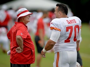 Kansas City Chiefs defensive line coach Tommy Brasher, left, talks with defensive end Mike DeVito during NFL football training camp Saturday, Aug. 8, 2015, in St. Joseph, Mo. (Andrew Carpenean/The St. Joseph News-Press via AP)