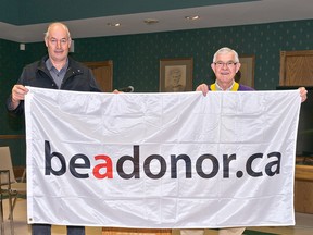 Ashfield-Colborne-Wawanosh Township will fly the “Be A Donor” flag for the month of April in recognition of Organ Donor Month. Pictured here is ACW Reeve Ben Van Diepenbeek (left) and Bob Robson, president of the Goderich Lions Club. (Contributed photo)