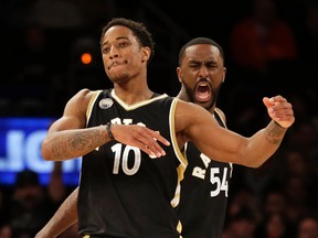 DeMar DeRozan and Patrick Patterson celebrate a big moment in Sunday's win over the Knicks. USA TODAY