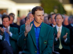 Defending Masters champion Jordan Spieth waves during presentation following the final round of the Masters golf tournament in Augusta, Ga., on April 10, 2016. (AP Photo/Chris Carlson)