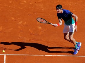 Milos Raonic of Canada plays a shot to Marco Cecchinato of Italy during his first-round match in the Monte Carlo Masters Monday. (REUTERS/Eric Gaillard)