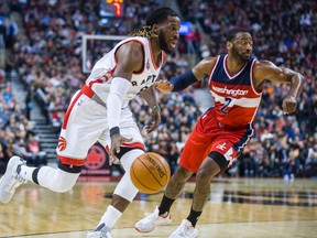 Toronto Raptors forward DeMarre Carroll drives past Washington Wizards defender John Wall in Toronto, Wednesday December 30, 2015. (Ernest Doroszuk/Toronto Sun/Postmedia Network)