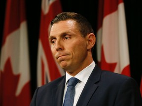 Conservative Party Leader Patrick Brown speaks to the media after his meeting with Premier Kathleen Wynne and NDP Leader Andrea Horwath at Queen's Park in Toronto April 11, 2016. (Stan Behal/Toronto Sun)