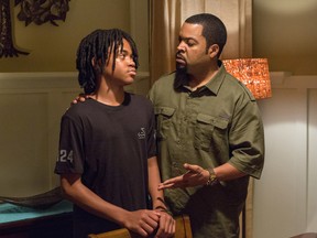 In this image released by Warner Bros., Michael Rainey Jr., left, and Ice Cube appear in a scene from "Barbershop: The Next Cut." (Chuck Zlotnick/Warner Bros. via AP)