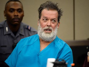 In this Dec. 9, 2015 file photo, Robert Lewis Dear, middle, talks during a court appearance in Colorado Springs, Colo. Dear, who acknowledges killing three people at a Colorado Planned Parenthood clinic idolized an abortion foe who killed a Florida doctor more than two decades earlier, court documents show. (Andy Cross/The Denver Post via AP, Pool, File)