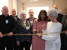 Part of the group participating in the ribbon cutting at the expansion of the Villa Minto were (Back row left to right) Dave Butler from CGV Builders, Neil McVicar of Architecture 49, Paul Chatelain CEO of MICs. (Front Row) Gilles Chartrand Vice Chair for Lady Minto Hospital, Pat Dorff Board Chair for Lady Minto Hospital both on MICs' board, Dipika Dameria, Associate Minister of Health and Long-Term Care, Francis Labelle and MPP John Vanthof (NDP — Timiskaming-Cochrane). Also included the ribbon cutting were Marcel Labelle, Diane Stringer director of care at MICs,  Gerry Côté representing the residents and Maureen Konopelky.