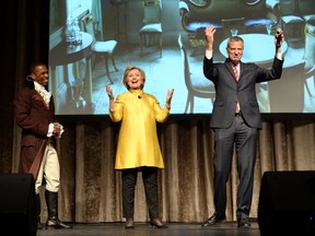 Leslie Odum Jr., left, from the Broadway musical "Hamilton," presidential candidate  Hillary Clinton, centre, and New York City Mayor Bill de Blasio, right, perform at the 94th annual Inner Circle Dinner at the New York Hilton Hotel in Manhattan on April 9, 2016. (David Handschuh/The Inner Circle Via AP)