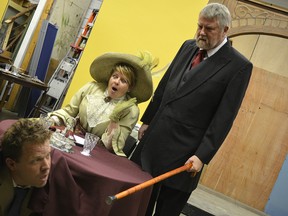Steve Jackson peaks out from under the table while Lyn Foulds and Doug Wright look on during a rehearsal for The Matchmaker. The play will be presented at Victoria Hall in Petrolia April 20 to 24. (Brent Boles/Postmedia Network)
