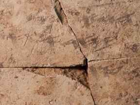 Letters inscribed on pottery, known as ostracons, which were unearthed in an excavation of a fort in Arad, Israel, and dated to about 600 B.C. shortly before Nebuchadnezzar’s destruction of Jerusalem, are seen in Israel Museum in Jerusalem Tuesday, April 12, 2016.  A Tel Aviv University team determined that this famous hoard of ancient Hebrew inscriptions was written by at least six different authors. Although the inscriptions are not from the Bible, their discovery suggests there was widespread literacy in ancient Judah at the time that would support the composition of biblical works.  (AP Photo/Dan Balilty)