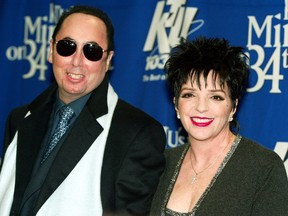 Singer Liza Minnelli and her husband David Gest pose for photographers backstage of the "Miracle on 34th Street" concert hosted by radio station WKTU in New York City, in this file photograph dated December 18, 2002. American music producer David Gest, the former husband of entertainer Liza Minnelli, died in London on April 12, 2016. REUTERS/Jeff Christensen/Files