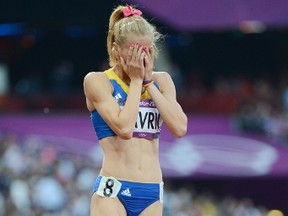Romania's Elena Mirela Lavric reacts after competing in the women's 800 semifinals at the athletics event during the London 2012 Olympic Games on August 9, 2012 in London. (AFP PHOTO/OLIVIER MORIN)