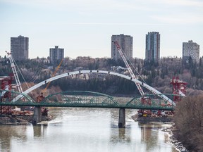 The second and final arch lift on the new Walterdale Bridge will raise the 2,000 tonne signature bridge arch about 20 metres to 54 metres above the river. The was expected to take about eight hours. Shaughn Butts / POSTMEDIA NEWS NETWORK