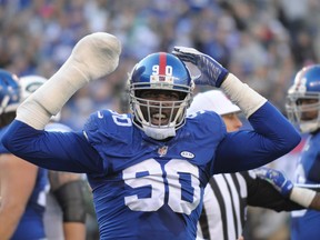 Giants defensive end Jason Pierre-Paul said he could see every ligament in his hand after a fireworks accident last July. (Bill Kostroun/AP Photo/Files)