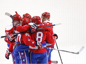 Washington Capitals centre Marcus Johansson celebrates with teammates after scoring a goal against the Pittsburgh Penguins in the second period at Verizon Center in Washington on April 7, 2016. (Geoff Burke/USA TODAY Sports)