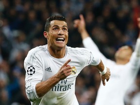 Real Madrid’s Cristiano Ronaldo celebrates after scoring against Wolfsburg in Champions League quarterfinal play Tuesday in Madrid.
(Reuters/Juan Medina)