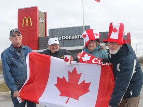 Peter Huffman, Wayne Ough, Valerie Durrant and Stan Durrant proudly show off their Canadian pride outside Port Hope McDonald's. Tuesday, April 12, 2016. (Pete Fisher/Postmedia Network)