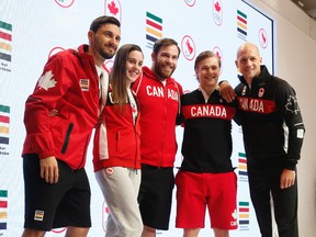 Canadian Olympians Joseph Polossifakis, sabre fencing (L), Aurelie Rivard, para-swimmer, Hugo Barrette, cycling - track, Korey Jarvis, wrestler, and Ben Russell, canoe/kayak sprint show off their Rio Olympics gear at the Art Gallery of Ontario in Toronto Tuesday, April 12, 2016. (Jack Boland/Toronto Sun)