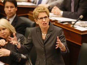 Premier Kathleen Wynne addresses the legislature at Queen's Park on Tuesday. (Stan Behal/Toronto Sun/Postmedia Network)