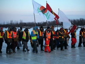 Youth from up the coast making their entry to Attawapiskat marching on the Attawapiskat River during a walk last week to raise awareness of suicides on First Nations. PHOTO COURTESY OF JACKIE HOOKIMAW WITT