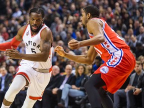 Toronto Raptors forward DeMarre Carroll drives on Philadelphia 76ers defender Hollis Thompson during NBA play in Toronto Tuesday, April 12, 2016. (Ernest Doroszuk/Toronto Sun/Postmedia Network)