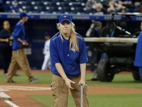 Grounds crew staffer Anne Lewicki helps to get the field ready before the Toronto Blue Jays played against the New York Yankees at the Rogers Centre on April 12, 2016. (CRAIG ROBERTSON/Toronto Sun)