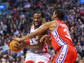 Raptors’ DeMarre Carroll tries to drive past Philadelphia 76ers’ Hollis Thompson during last night’s game. (ERNEST DOROSZUK/Toronto Sun)