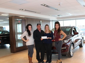 Cambrian College Graduate Certificate students Maxime Mayotte, left, Gabrielle Bonin and Sarah Kaelas present a cheque for $2,538.94 to Michel Leroux, second left, of the Adaptive Canuck ALS Foundation. Supplied photo