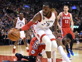 Toronto Raptors forward DeMarre Carroll dribbles past Philadelphia 76ers center Nerlens Noel in the second half at Air Canada Centre in Toronto on April 12, 2016. (Dan Hamilton/USA TODAY Sports)