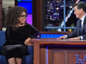 In this photo provided by CBS, Oprah Winfrey, left, the chairman and chief executive officer of OWN, joins host Stephen Colbert on the set of the “Late Show with Stephen Colbert” in New York, Thursday, Oct. 15, 2015. (John Paul Filo/CBS via AP)