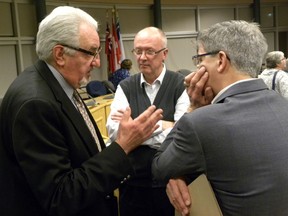 Ernst Kuglin/The Intelligencer
Quinte Health Care board member Stuart Wright (left) is seen here talking to Our TMH vice chairman John Smylie and Trenton Memorial Hospital foundation chairman Phil wild, following the March 30 Our TMH information meeting. Well-known community volunteer Evelyn Wilson is questioning the conduct of Wright following the meeting and has written QHC board chair Tricia Anderson detailing incident. Wilson is demanding an apology.