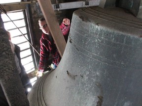 Our Lady of Mercy church's Chris Burley talks about the institution's 150-year-old bell, which fell when its yoke failed last autumn. A new assembly, delivered to the church Wednesday, is being installed to get it ringing again. Tyler Kula/Sarnia Observer/Postmedia Network