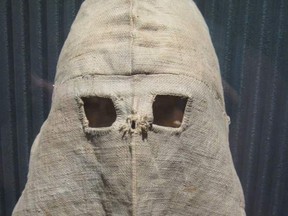 Calico hoods were worn by all prisoners in solitary confinement when outside their cells under the Pentonville system. (Wikimedia Commons)