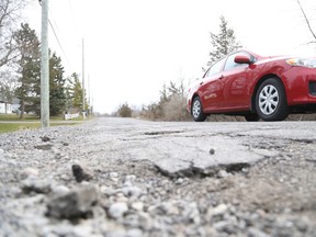 Jason Miller/The Intelligencer
A vehicle navigates a bumpy Marshall Road, which is trending on the CAA's worst road listings.