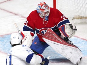 Canadiens goalie Mike Condon (39) makes a save against Lightning centre Brian Boyle (11) during first period NHL action at the Bell Centre in Montreal on April 9, 2016. (Jean-Yves Ahern/USA TODAY Sports)