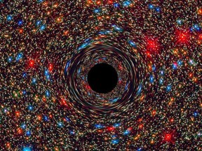 This computer-simulated image shows a supermassive black hole at the core of a galaxy. The black region in the centre represents the black hole's event horizon, where no light can escape the massive object's gravitational grip. The black hole's powerful gravity distorts space around it like a funhouse mirror. Light from background stars is stretched and smeared as the stars skim by the black hole. NASA/Supplied